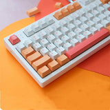 gaming keyboard with a set of peach keycaps