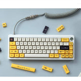 keyboard with yellow bee keycaps kit